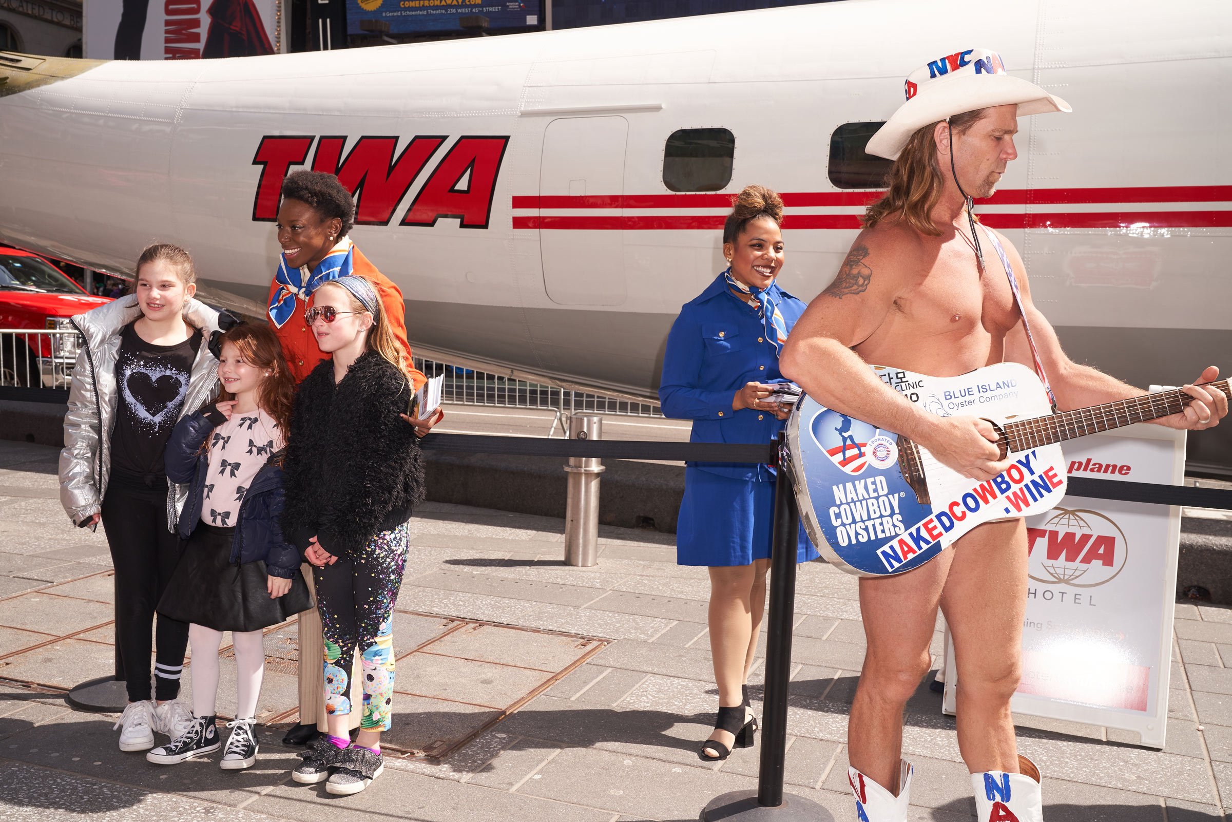 It doesn’t get more Times Square than this! The Naked Cowboy photobombs Connie on March 24, 2019. 