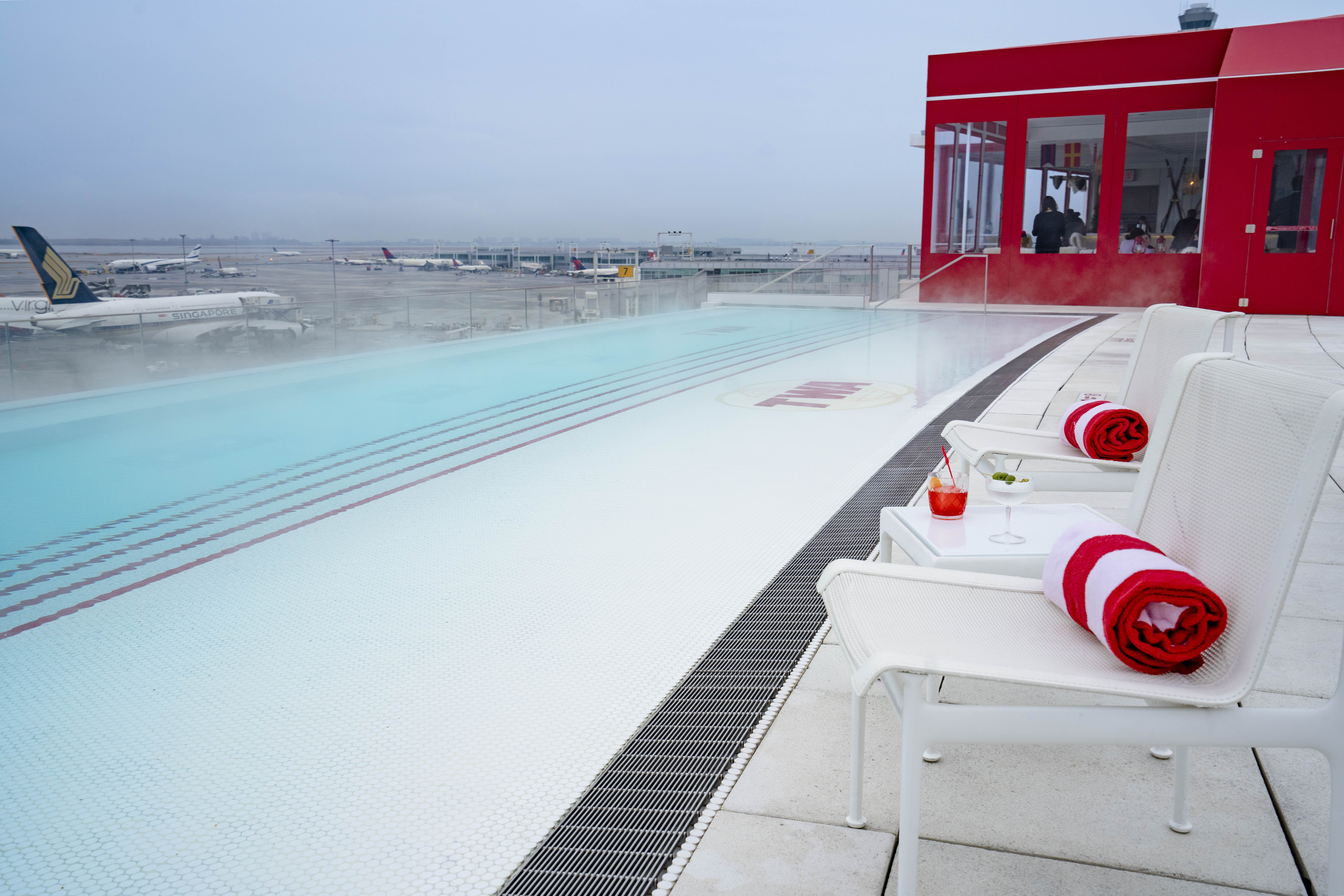 The pool is located on the TWA Hotel roof overlooking JFK’s runway 4L/22R.
